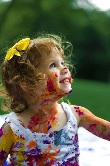 Child painting, smiling | Self esteem for creative children and neurodiversity