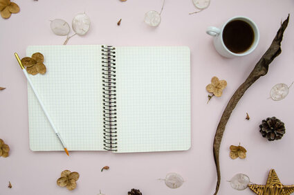 Picture of a journal without writing or sketching on it. A concierge therapist from Richmond, VA can provide creativity coaching in Canada, the US, the United Kingdom, and beyond. Learn about therapy for creatives here!