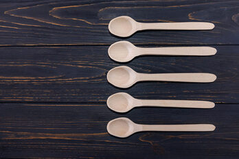 Picture of wooden spoons on a darker wooden background. This represents the freedom creative people in Maryland, Virginia, and beyond have in determining their creative personality needs. A creativity coach in the United States can help.