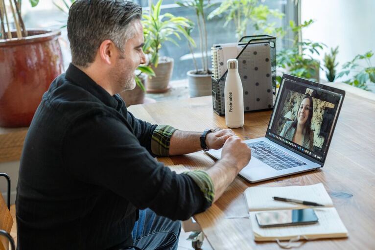 Adult male seated at desk on zoom call | Creativity Coaching for Businesses, see Business Growth through Creativity, the Relationship between Creativity and Productivity