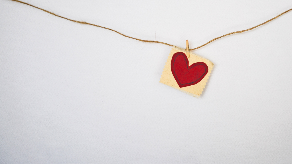 Flannel Heart Square hanging from clothesline on white wall | Therapy for Creatives, Three Steps to Manage a Crisis for Creative People, Counseling for Creative People in Maryland