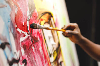 Picture of a person painting on a canvas. Coaching for creative people in Maryland and Virginia can help you thrive in your creativity. Reach out for creativity coaching and creativity counseling in Baltimore, MD and Richmond, VA here.